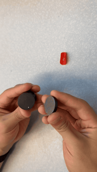 Attaching adhesive magnet to base